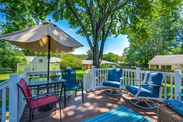 2207 Robinhood Dr, Wooster, OH 44691 - deck featuring outdoor dining space and a storage shed