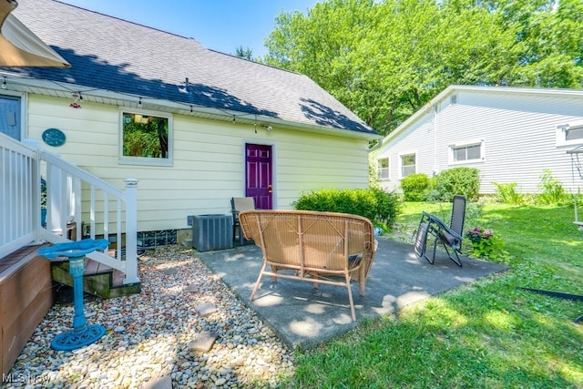 2207 Robinhood Dr, Wooster, OH 44691 - rear view of house with a patio, roof with shingles, and a lawn