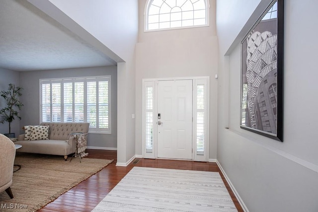 31008 Logan Ct, Westlake, OH 44145 - entryway with dark wood-style floors and a towering ceiling