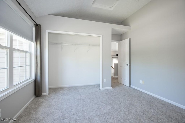 31008 Logan Ct, Westlake, OH 44145 - unfurnished bedroom featuring carpet floors, a closet, and attic access