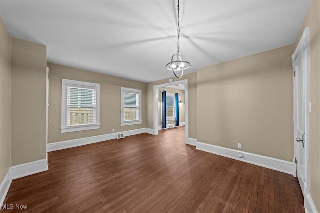 2905 Jay Ave, Cleveland, OH 44113 - unfurnished dining area with dark wood-style floors and a chandelier