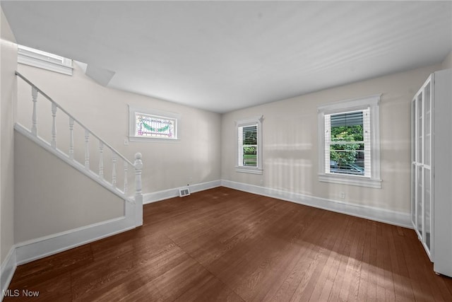 2905 Jay Ave, Cleveland, OH 44113 - unfurnished living room featuring hardwood / wood-style flooring and stairway