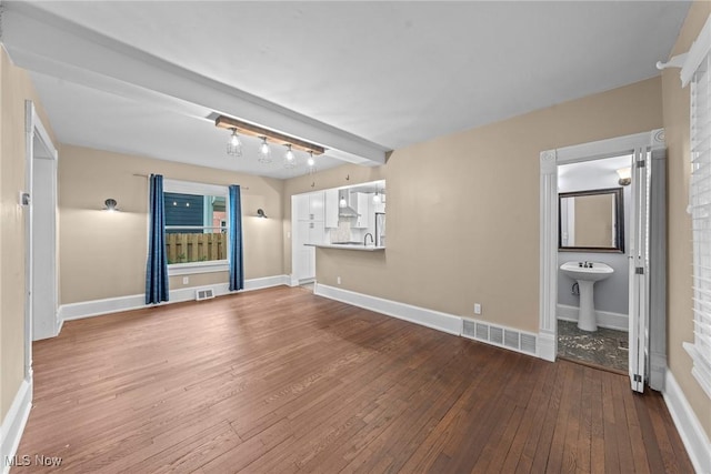 2905 Jay Ave, Cleveland, OH 44113 - unfurnished living room with wood-type flooring and baseboards