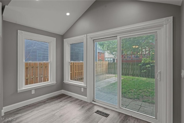 2905 Jay Ave, Cleveland, OH 44113 - doorway to outside with lofted ceiling, wood finished floors, and recessed lighting