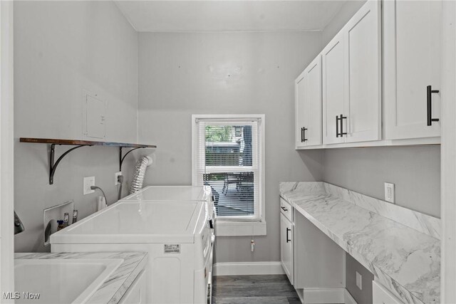2905 Jay Ave, Cleveland, OH 44113 - laundry room featuring cabinet space, washer and dryer, and dark wood finished floors
