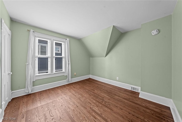 2905 Jay Ave, Cleveland, OH 44113 - additional living space featuring wood finished floors and vaulted ceiling