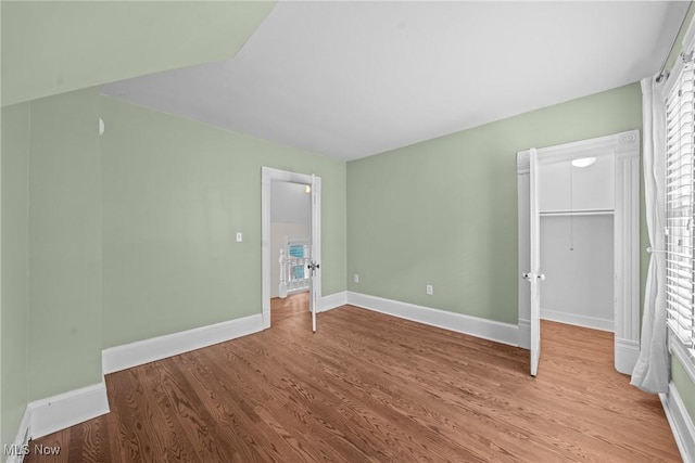 2905 Jay Ave, Cleveland, OH 44113 - unfurnished bedroom with wood finished floors and a spacious closet