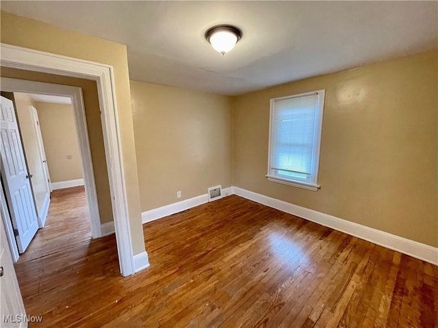 918 Silvercrest Ave, Akron, OH 44314 - empty room featuring baseboards and wood finished floors