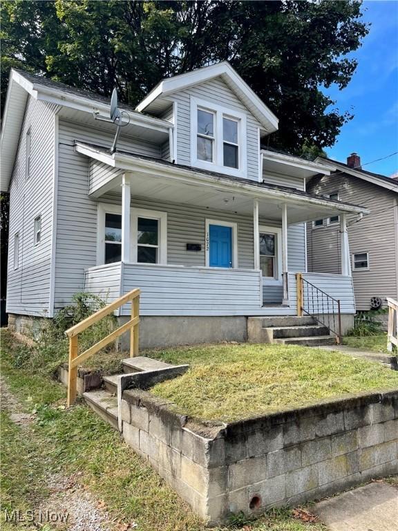 1072 Pitkin Ave, Akron, OH 44310 - view of front of property featuring covered porch and a front yard