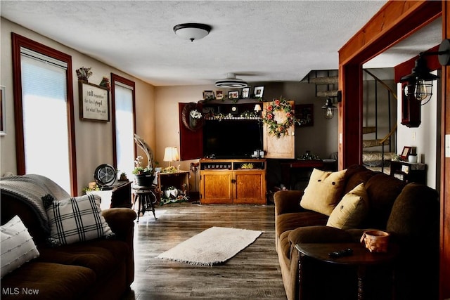 1511 Lake Front Dr, Salem, OH 44460 - living area featuring dark wood-style floors, a textured ceiling, and stairs