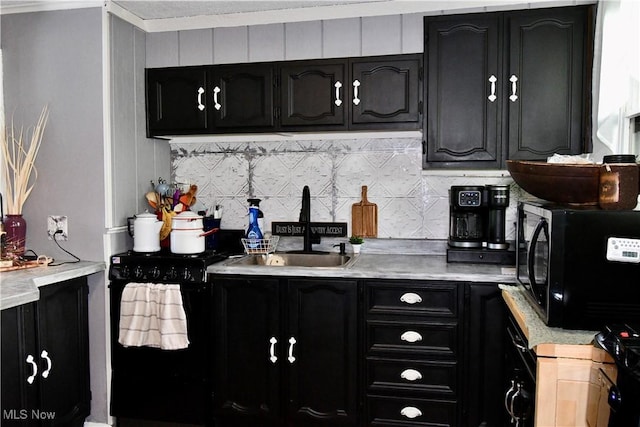 1511 Lake Front Dr, Salem, OH 44460 - kitchen with light countertops, dark cabinets, backsplash, and black microwave