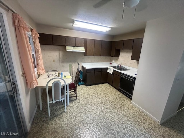 10247 Smugglers Cv, Reminderville, OH 44202 - kitchen with under cabinet range hood, black dishwasher, dark brown cabinetry, light countertops, and light floors
