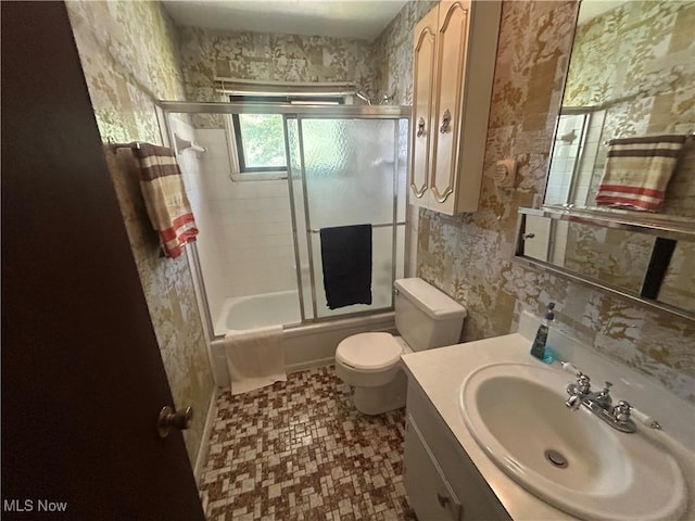 10247 Smugglers Cv, Reminderville, OH 44202 - full bath featuring vanity, wallpapered walls, and bath / shower combo with glass door