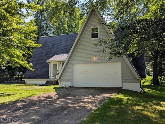 10247 Smugglers Cv, Reminderville, OH 44202 - a-frame style home with driveway, a front yard, roof with shingles, entry steps, and a garage