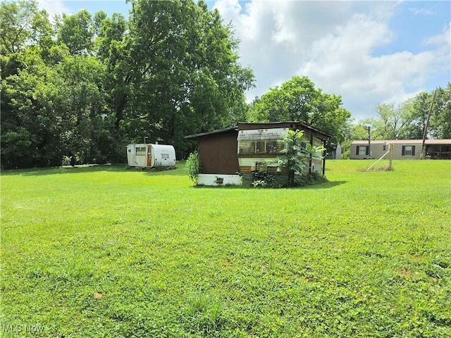 99 E Apple Blossom Way, Elizabeth, WV 26143 - view of grassy yard with a storage unit