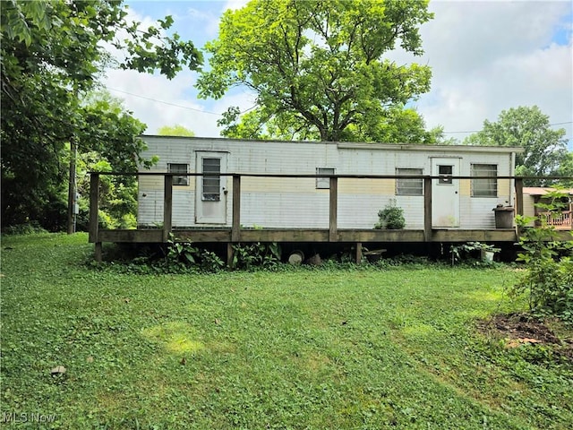 99 E Apple Blossom Way, Elizabeth, WV 26143 - back of house with a wooden deck and a yard