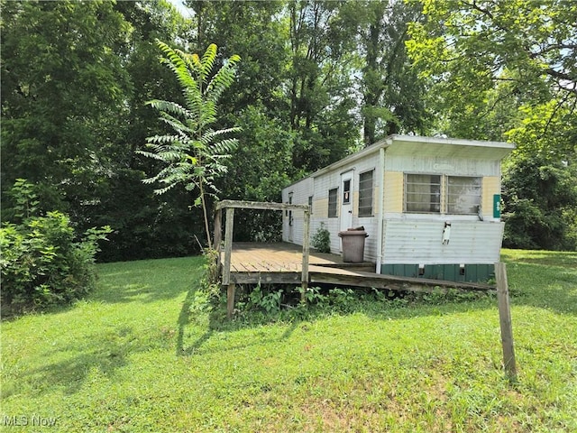 99 E Apple Blossom Way, Elizabeth, WV 26143 - view of grassy yard with a wooden deck and an outbuilding