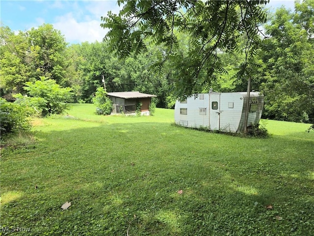 99 E Apple Blossom Way, Elizabeth, WV 26143 - view of green lawn featuring a storage shed