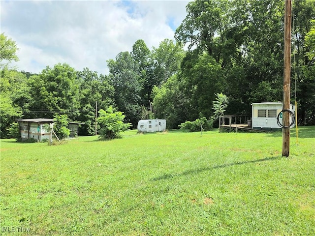 99 E Apple Blossom Way, Elizabeth, WV 26143 - view of green lawn featuring a storage unit