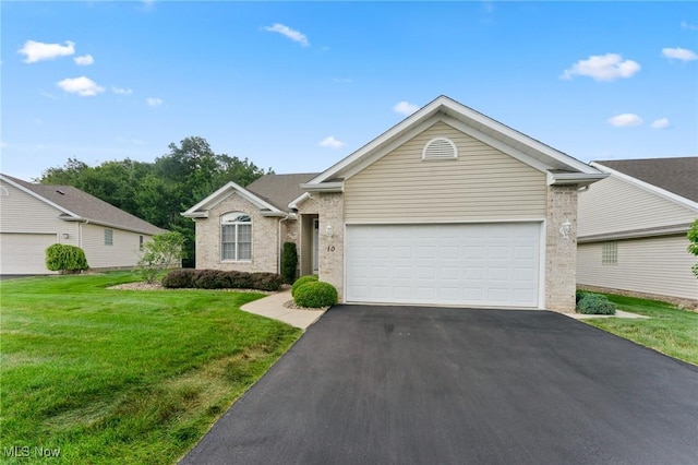 7900 Walnut St Unit 10, Boardman, OH 44512 - ranch-style home featuring asphalt driveway, a front lawn, a garage, and brick siding