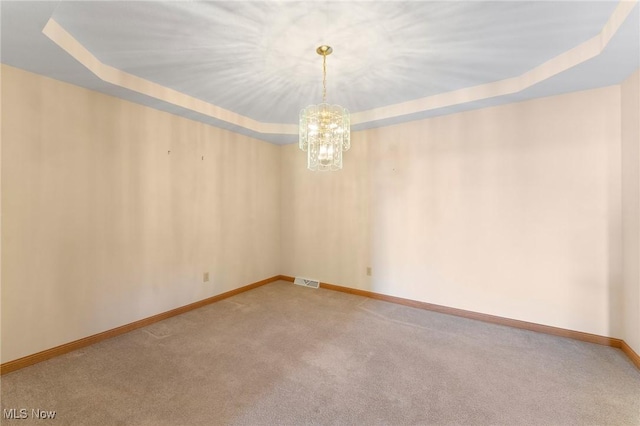 7900 Walnut St Unit 10, Boardman, OH 44512 - unfurnished room featuring carpet, a chandelier, and a raised ceiling