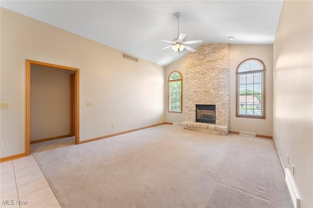 7900 Walnut St Unit 10, Boardman, OH 44512 - unfurnished living room with healthy amount of natural light, ceiling fan, lofted ceiling, carpet, and a brick fireplace