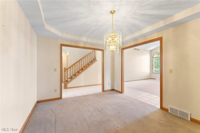 7900 Walnut St Unit 10, Boardman, OH 44512 - carpeted spare room featuring stairs, a chandelier, and tile patterned flooring