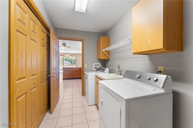 7900 Walnut St Unit 10, Boardman, OH 44512 - laundry area featuring cabinet space, independent washer and dryer, light tile patterned flooring, and a textured ceiling