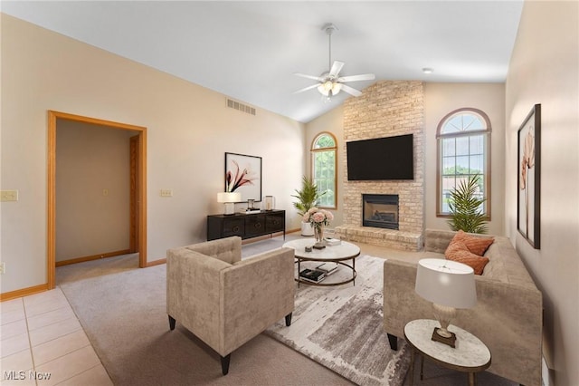 7900 Walnut St Unit 10, Boardman, OH 44512 - carpeted living area with healthy amount of natural light, a ceiling fan, lofted ceiling, a fireplace, and tile patterned flooring