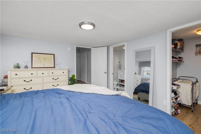 1921 Adrian Cir, Sandusky, OH 44870 - bedroom with wood finished floors and a textured ceiling