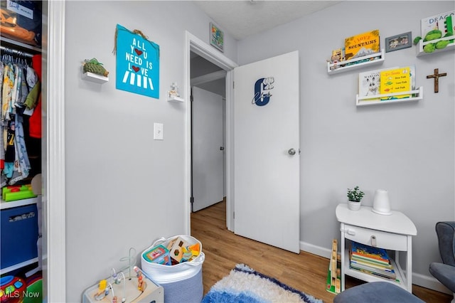 1921 Adrian Cir, Sandusky, OH 44870 - rec room with wood finished floors and baseboards