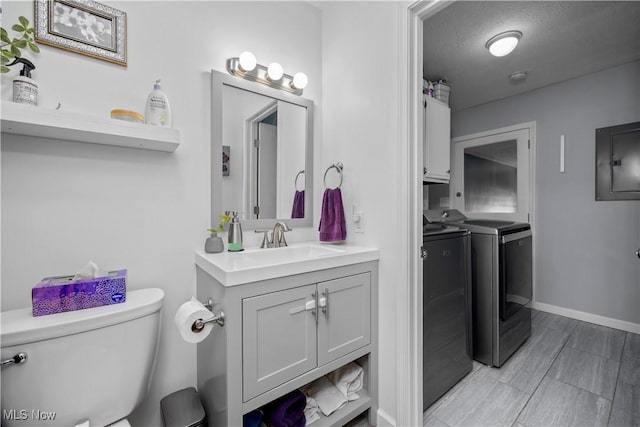 1921 Adrian Cir, Sandusky, OH 44870 - bathroom featuring washing machine and clothes dryer, vanity, and electric panel