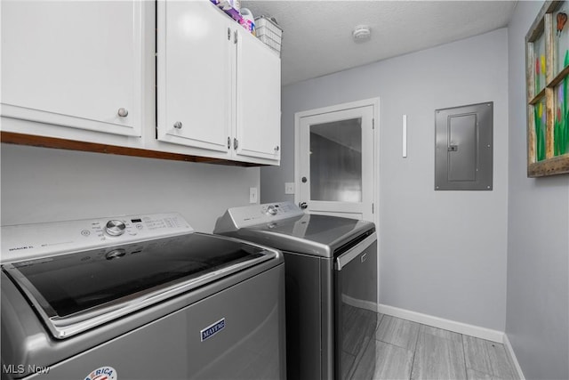1921 Adrian Cir, Sandusky, OH 44870 - washroom featuring electric panel, washing machine and clothes dryer, and cabinet space