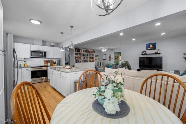 1921 Adrian Cir, Sandusky, OH 44870 - dining area featuring recessed lighting, ceiling fan, and light wood finished floors