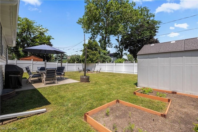 1921 Adrian Cir, Sandusky, OH 44870 - fenced backyard featuring a vegetable garden, a patio, and a storage unit