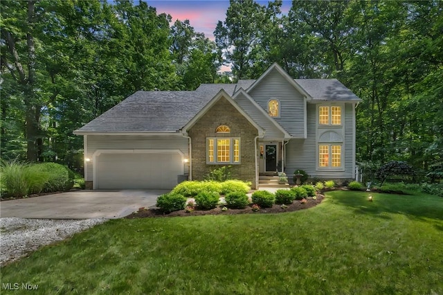 949 S Medina Line Rd, Wadsworth, OH 44281 - traditional-style house featuring concrete driveway, a garage, and a yard