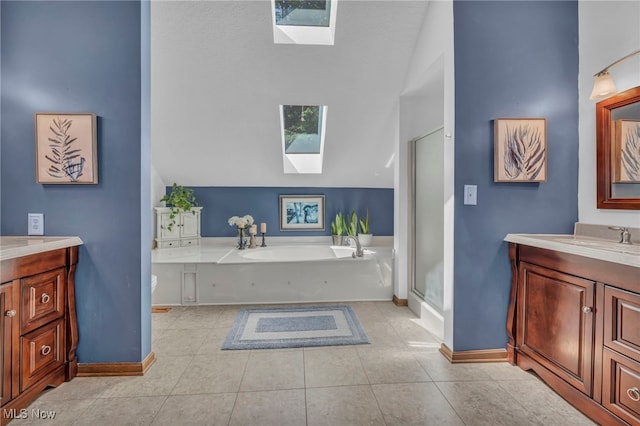 949 S Medina Line Rd, Wadsworth, OH 44281 - full bath with a skylight, vanity, a garden tub, a shower stall, and high vaulted ceiling