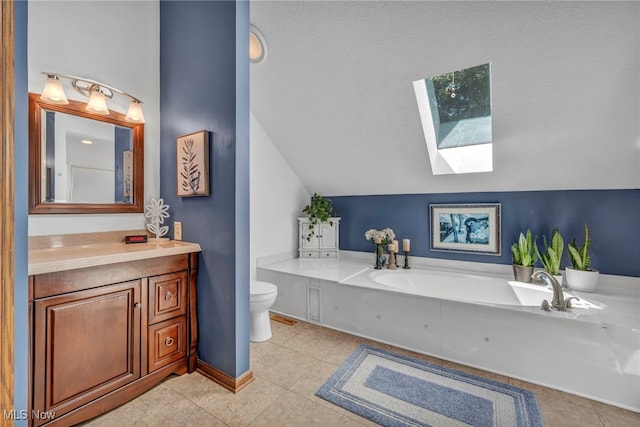 949 S Medina Line Rd, Wadsworth, OH 44281 - bathroom with a skylight, vanity, tile patterned floors, lofted ceiling, and a bath