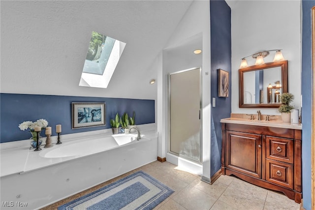 949 S Medina Line Rd, Wadsworth, OH 44281 - full bathroom with lofted ceiling, a skylight, a shower stall, a garden tub, and vanity