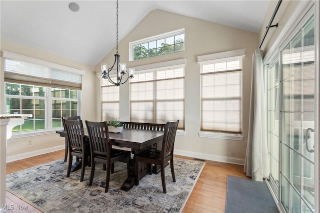 4276 Brownstone Ln, Medina, OH 44256 - dining space with a chandelier, plenty of natural light, lofted ceiling, and light wood-type flooring
