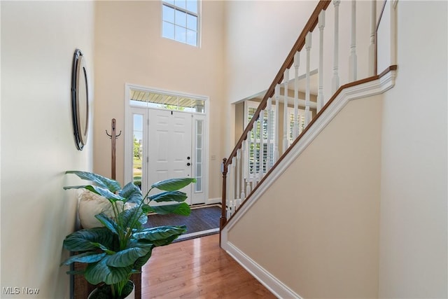 4276 Brownstone Ln, Medina, OH 44256 - foyer featuring stairs, a towering ceiling, and wood finished floors