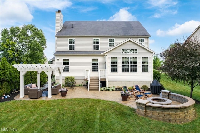 4276 Brownstone Ln, Medina, OH 44256 - back of property with a lawn, an outdoor living space with a fire pit, and a pergola