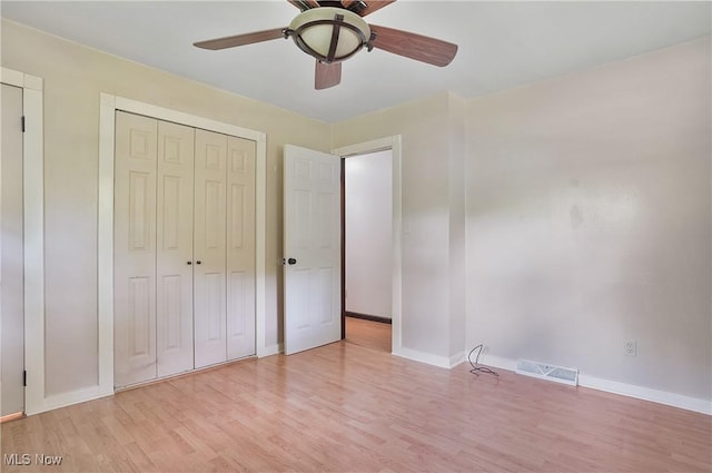 662 Beech Ave, Youngstown, OH 44512 - unfurnished bedroom with light wood finished floors, a closet, and ceiling fan