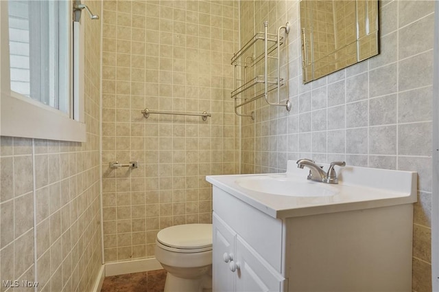 662 Beech Ave, Youngstown, OH 44512 - bathroom with tile walls, vanity, and tile patterned floors