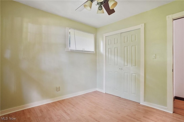 662 Beech Ave, Youngstown, OH 44512 - unfurnished bedroom featuring wood finished floors, a closet, and a ceiling fan