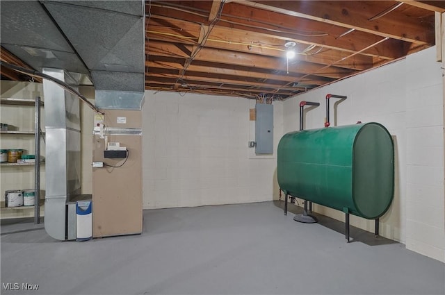 662 Beech Ave, Youngstown, OH 44512 - unfinished basement featuring oil tank, electric panel, heating unit, and concrete block wall