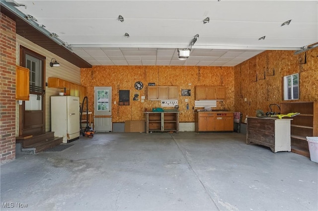 662 Beech Ave, Youngstown, OH 44512 - garage featuring freestanding refrigerator and a garage door opener