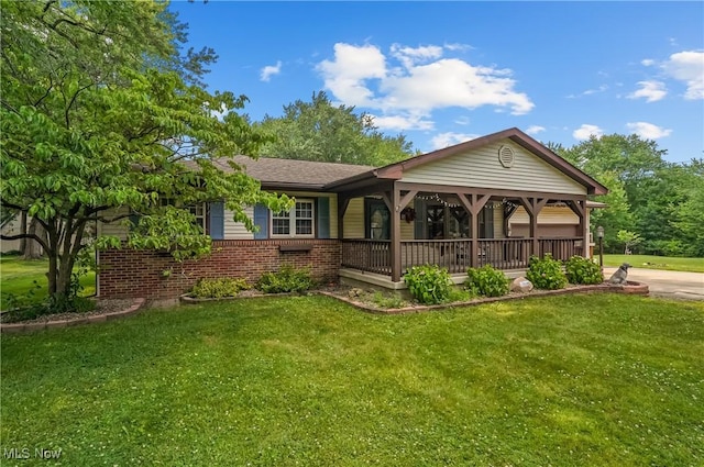 662 Beech Ave, Youngstown, OH 44512 - ranch-style home featuring a front yard, brick siding, and a porch