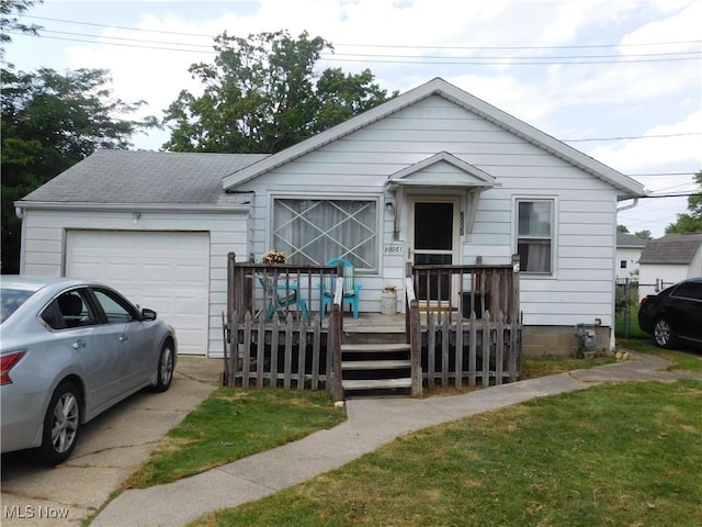 30051 Regent Rd, Wickliffe, OH 44092 - view of front facade featuring an attached garage, a shingled roof, and driveway