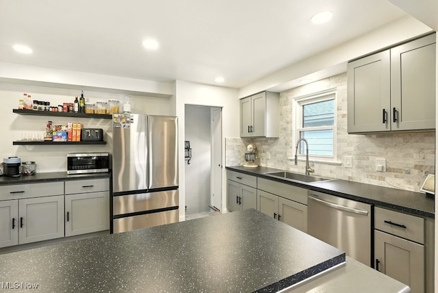 13806 Carpenter Rd, Garfield Heights, OH 44125 - kitchen featuring stainless steel appliances, dark countertops, tasteful backsplash, and recessed lighting